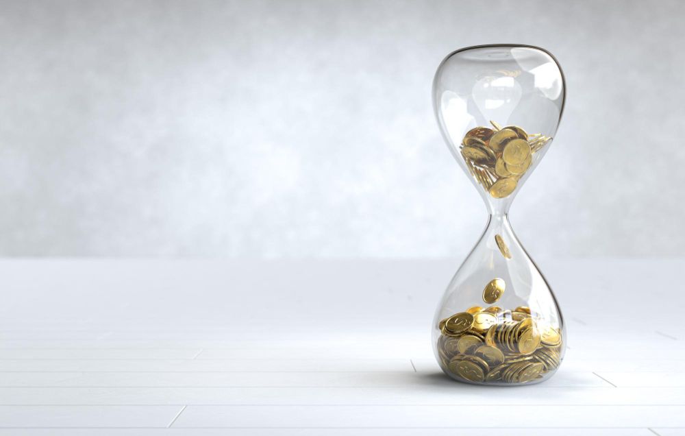gold-coin-hourglass-time-is-money-concept.jpg